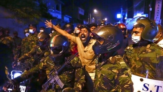 A Sri Lankan man shouts anti government slogans during a protest outside Sri Lankan president's private residence on the outskirts of Colombo, Sri Lanka,&nbsp;(AP)