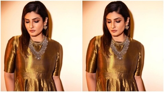 Raveena’s gown came with half sleeves and pleat details below the waist.(Instagram/@officialraveenatandon)