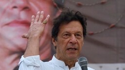 FILE PHOTO: Imran Khan, chairman of the Pakistan Tehreek-e-Insaf (PTI), gestures while addressing his supporters during a campaign meeting ahead of general elections in Karachi.&nbsp;