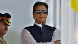 FILE - Pakistan's Prime Minister Imran Khan attends a military parade to mark Pakistan National Day, in Islamabad, Pakistan.&nbsp;