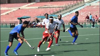 Haryana and Punjab teams in action during their semifinal match at the IAAD hockey tournament. (HT Photo)