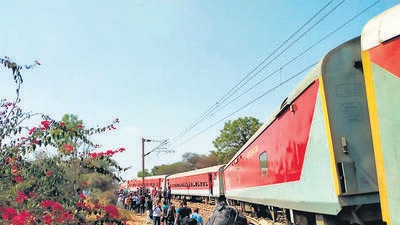 Nashik: Passengers wait near the Pawan Express train after several coaches of the train derailed between Lahavit and Devlali railway stations, near Nashik, Sunday, April 3, 2022. (PTI Photo)(PTI04_03_2022_000188A) (PTI)