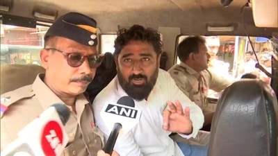 MNS leader Mahendra Bhanushali being taken to police custody in Mumbai. (ANI)