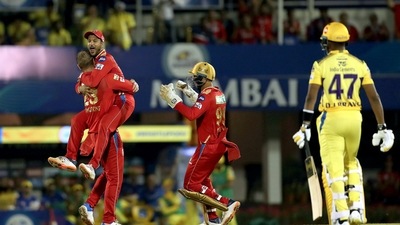 Liam Livingstone of Punjab Kings celebrates with team captain Mayank Agarwal after the wicket of Dwayne Bravo of Chennai Super Kings (PTI)