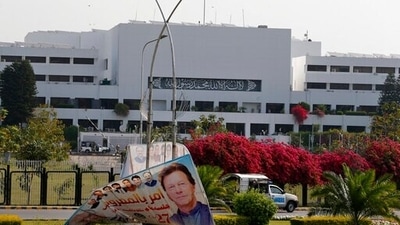 Pakistani paramilitary troops patrol near a billboard with the picture of Prime Minister Imran Khan outside the National Assembly in Islamabad. (AP) Pakistani paramilitary troops patrol near a billboard with the picture of Prime Minister Imran Khan outside the National Assembly in Islamabad. (AP)