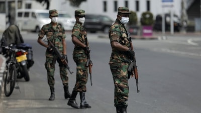 Sri Lankan army soldiers stand guard at a checkpoint after the government imposed a curfew following a clash between police and protestors near Sri Lankan President Gotabaya Rajapaksa's residence during a protest last Thursday, amid the country's economic crisis, in Colombo, Sri Lanka. (REUTERS)