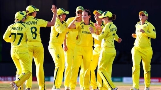Australia's Megan Schutt, center, is congratulated by teammates after taking the wicket of England's Tamsin Beaumont during the final of the ICC Women's Cricket World Cup in Christchurch, New Zealand.(AP)
