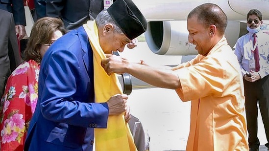 &nbsp;Nepal PM Sher Bahadur Deuba being greeted by UP CM Yogi Adityanath, in Varanasi.&nbsp;(PTI)