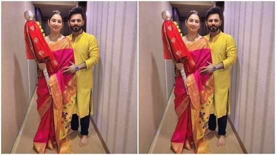 While Disha wore a pink and yellow silk saree with a matching blouse for the occasion, Rahul complemented her in a yellow embroidered kurta and black pants. Disha styled her look with a sleek bun, traditional nath, earrings, bangles, chain, mangalsutra, and minimal make-up.(Instagram/@dishaparmar)