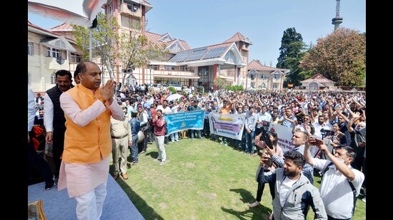 Himachal CM Jai Ram Thakur greets government staffers during the Karamchari Maha Sammelan in Shimla. (Deepak Sansta/HT)