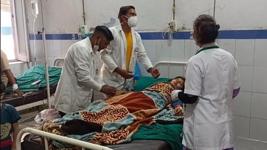 The people who fell ill after consuming buckwheat undergoing treatment at the district hospital in Haridwar on Sunday. (RAMESHWAR GAUR/HT PHOTO)