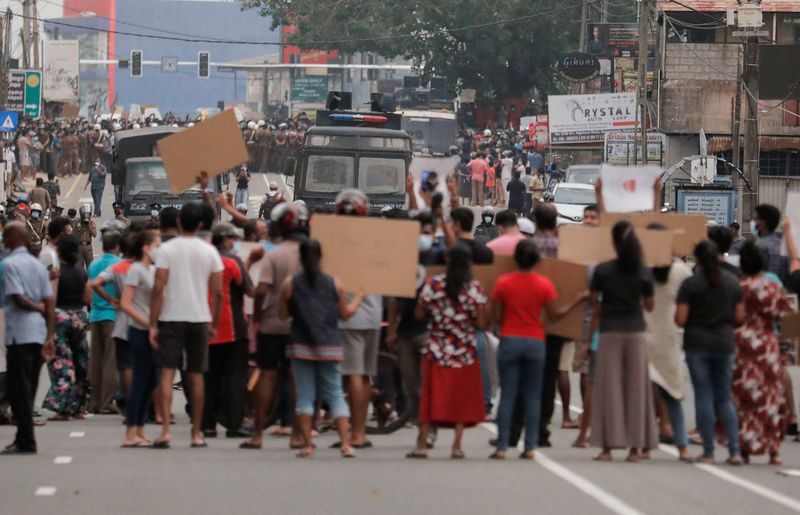 People attend a protest against Sri Lankan President Gotabaya Rajapaksa in a residential area in capital Colombo. (REUTERS)