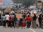 People attend a protest against Sri Lankan President Gotabaya Rajapaksa in a residential area in capital Colombo.