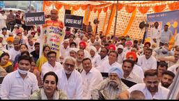 HDF workers staging a sit-in during a protest against alleged corruption outside Ambala MC office. (HT Photo)