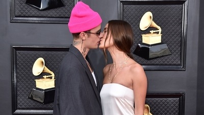 Justin and Hailey Bieber arrived on the red carpet looking dashing in a Balenciaga suit and a Saint Laurent dress. The couple also served us with some PDA moments at the awards show that soon became the talk of social media. (Jordan Strauss/Invision/AP) Justin and Hailey Bieber arrived on the red carpet looking dashing in a Balenciaga suit and a Saint Laurent dress. The couple also served us with some PDA moments at the awards show that soon became the talk of social media. (Jordan Strauss/Invision/AP)