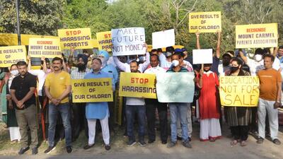 Parents during the silence protest against school fee hike outside Mount Carmel School, Sector 47, Chandigarh. (Keshav Singh/HT)