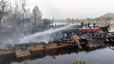 Fire tenders douse the fire as seven houseboats were gutted in a massive blaze at Nigeen Lake in Srinagar on Monday. (ANI) Fire tenders douse the fire as seven houseboats were gutted in a massive blaze at Nigeen Lake in Srinagar on Monday. (ANI)