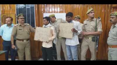 Mainpuri duo surrendering before the police on Monday (HT Photo)