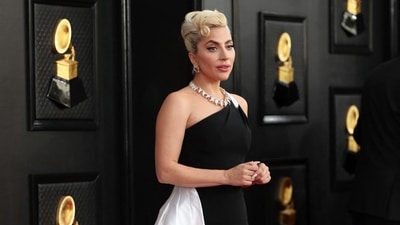 Lady Gaga took over the red carpet in a custom Giorgio Armani Privé monochromatic gown that spoke of her elegance and bold personality. She wore a one-shoulder dress featuring a figure-hugging silhouette and a long floor-sweeping train. A diamond choker necklace, matching earrings, and her blonde hair tied in an updo rounded off the look. (REUTERS)
