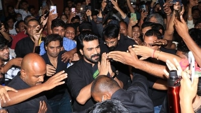 Ram Charan was mobbed by fans outside Mumbai's Gaiety theatre as he made a surprise appearance at a screening of his film RRR. Ram Charan was mobbed by fans outside Mumbai's Gaiety theatre as he made a surprise appearance at a screening of his film RRR.