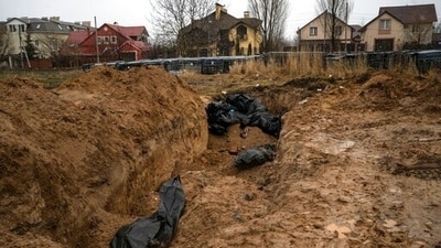 Bodies lie in a mass grave in Bucha, on the outskirts of Kyiv, Ukraine. (AP Photo/Rodrigo Abd) (AP) Bodies lie in a mass grave in Bucha, on the outskirts of Kyiv, Ukraine. (AP Photo/Rodrigo Abd) (AP)