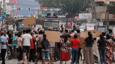 People attend a protest against Sri Lankan President Gotabaya Rajapaksa in a residential area in capital Colombo. (REUTERS)