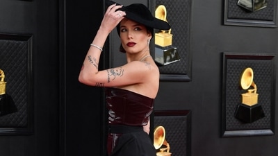 Halsey chose a unique structured gown by Pressiat for her Grammys' red carpet appearance. She teamed the ensemble with an elegant hat and Tiffany jewels. (AFP) Halsey chose a unique structured gown by Pressiat for her Grammys' red carpet appearance. She teamed the ensemble with an elegant hat and Tiffany jewels. (AFP)