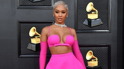 Saweetie chose a bright pink custom Valentino skirt and bralette set with sleek Opera gloves and a diamond choker necklace. The US rapper's platinum blonde hair took the glam quotient up by a notch. (AFP) Saweetie chose a bright pink custom Valentino skirt and bralette set with sleek Opera gloves and a diamond choker necklace. The US rapper's platinum blonde hair took the glam quotient up by a notch. (AFP)