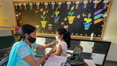 A healthcare worker administers a dose of Covid-19 vaccine to a student in the age group of 12-14 years, at a school in Vasundhara, in Ghaziabad. A Bharat Biotech official on Monday denied that WHO’s suspension will have an impact on Covaxin market in the US. (PTI) A healthcare worker administers a dose of Covid-19 vaccine to a student in the age group of 12-14 years, at a school in Vasundhara, in Ghaziabad. A Bharat Biotech official on Monday denied that WHO’s suspension will have an impact on Covaxin market in the US. (PTI)
