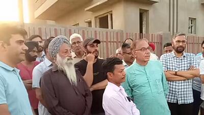 Hapless residents gathered at Sunny Enclave, Sector 123, Mohali. (HT Photo)