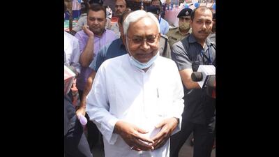 Chief minister Nitish Kumar leaves after casting his vote in the Bihar MLC elections in Patna on Monday. (Santosh Kumar/HT Photo)