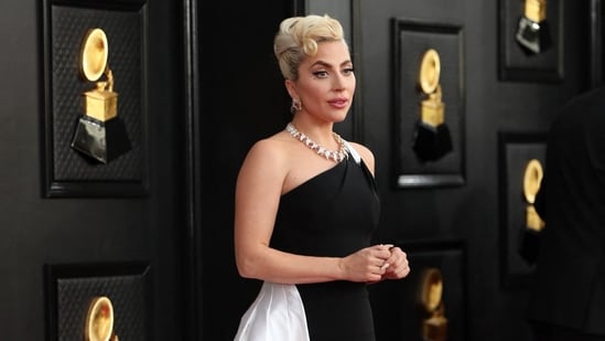 Lady Gaga took over the red carpet in a custom Giorgio Armani Privé monochromatic gown that spoke of her elegance and bold personality. She wore a one-shoulder dress featuring a figure-hugging silhouette and a long floor-sweeping train. A diamond choker necklace, matching earrings, and her blonde hair tied in an updo rounded off the look.(REUTERS)