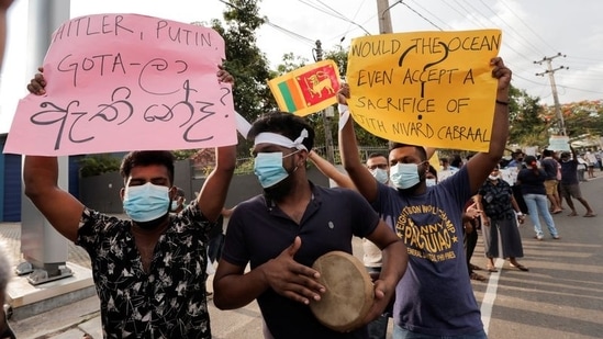 People took to streets, shouting slogans and held posters against President Gotabaya Rajapaksa in a residential area in Colombo, Sri Lanka. Amid the ongoing emergency, Rajapaksa had given the Sri Lankan military sweeping powers, including the right to arrest suspects without warrants.(REUTERS)