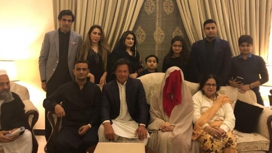A file photo of Imran Khan seated with his wife Bushra Bibi.(Twitter/PTI Official)