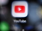 This file photo taken on October 12, 2021, shows the Youtube logo on a smartphone screen. This file photo taken on October 12, 2021, shows the Youtube logo on a smartphone screen.