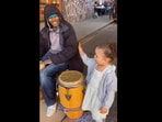The little girl and street drummer performing Camila Cabello's Havana in the Instagram video. (instagram/@goodnewscorrespondent)