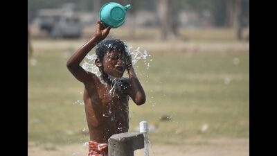 A slum kid cools off on a hot day at a public tap in Prayagraj. A heatwave swept through the city that recorded a high of 42.5 degrees Celsius, 5 degrees above normal, on Tuesday. (Anil Kumar Maurya/HT) A slum kid cools off on a hot day at a public tap in Prayagraj. A heatwave swept through the city that recorded a high of 42.5 degrees Celsius, 5 degrees above normal, on Tuesday. (Anil Kumar Maurya/HT)