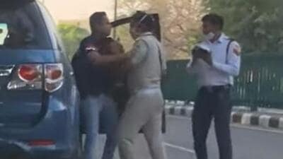 The two Chandigarh Traffic Police personnel were caught on camera while manhandling the SUV driver on April 2. (Video grab)