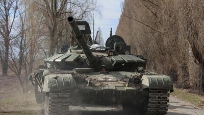 A Ukrainian service member drives a captured Russian T-72 tank, in the recently liberated village of Lukianivka, in Kyiv region. (REUTERS) A Ukrainian service member drives a captured Russian T-72 tank, in the recently liberated village of Lukianivka, in Kyiv region. (REUTERS)