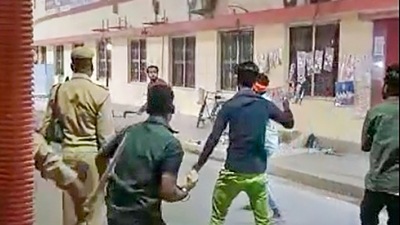 An unidentified person attacks constables at Gorakhnath Temple gate, on Sunday night. (PTI) An unidentified person attacks constables at Gorakhnath Temple gate, on Sunday night. (PTI)