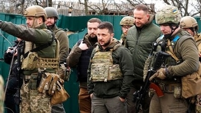 Ukrainian President Volodymyr Zelenskyy examines the site of a recent battle in Bucha close to Kyiv, Ukraine, Monday, April 4, 2022. (AP Photo/Efrem Lukatsky) (AP) Ukrainian President Volodymyr Zelenskyy examines the site of a recent battle in Bucha close to Kyiv, Ukraine, Monday, April 4, 2022. (AP Photo/Efrem Lukatsky) (AP)