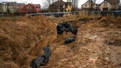 Bodies lie in a mass grave in Bucha, on the outskirts of Kyiv, Ukraine. (AP Photo/Rodrigo Abd) (AP)