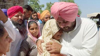 Former PPCC president Navjot Singh Sidhu along with other former Congress MLAs meeting grieving kin of Nishan Singh, who was among four persons shot dead during a clash over land at Phulara village in Gurdaspur district. The Gurdaspur police have booked 14 persons, including a retired forest guard, for allegedly killing three persons in the clash. (HT Photo) Former PPCC president Navjot Singh Sidhu along with other former Congress MLAs meeting grieving kin of Nishan Singh, who was among four persons shot dead during a clash over land at Phulara village in Gurdaspur district. The Gurdaspur police have booked 14 persons, including a retired forest guard, for allegedly killing three persons in the clash. (HT Photo)