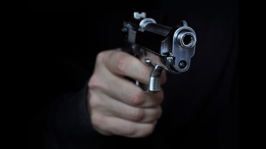 The 5 masked men pointed a gun at the trader and fled with his car. (Getty Images/iStockphoto)
