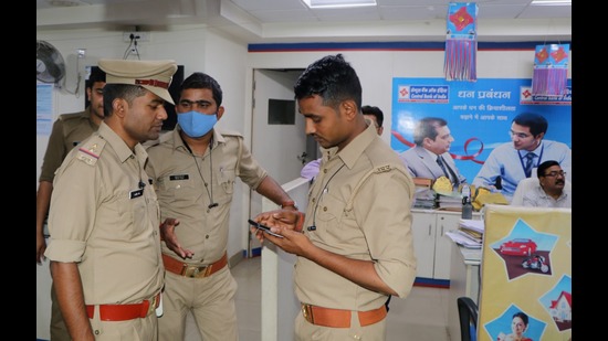 Policemen at the bank’s branch in Kanpur to investigate the theft of valuables from lockers. (Sourced)