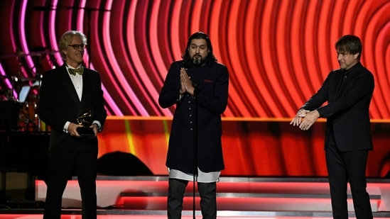 Stewart Copeland and Ricky Kej accept the award for Best New Age album "Divine Tides" during the the 64th Annual Grammy Awards pre-telecast show in Las Vegas on April 3, 2022. (Photo by VALERIE MACON / AFP)(AFP)