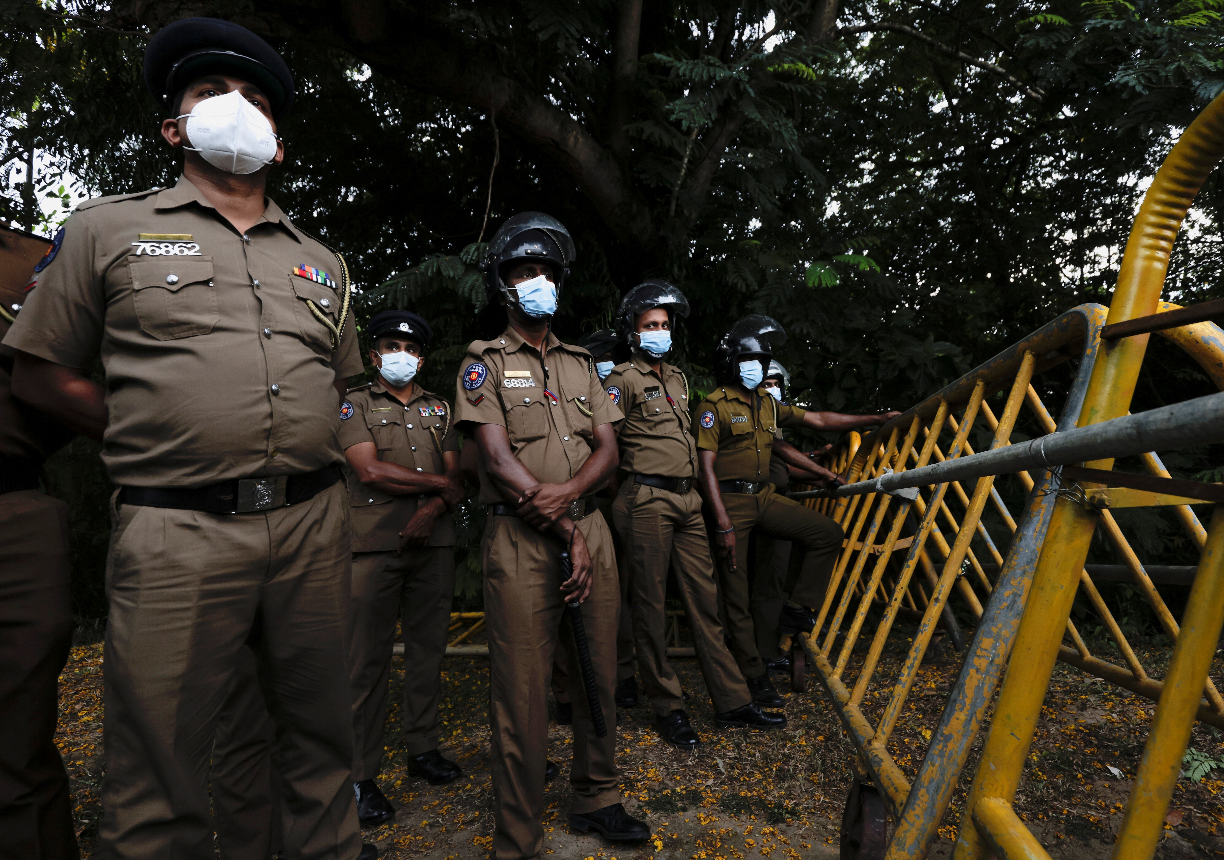 Sri Lanka police officers stand guard on a road leading to the parliament building, after the government of President Gotabaya Rajapaksa lost its majority, amid the country's economic crisis, in Colombo, Sri Lanka. (REUTERS)