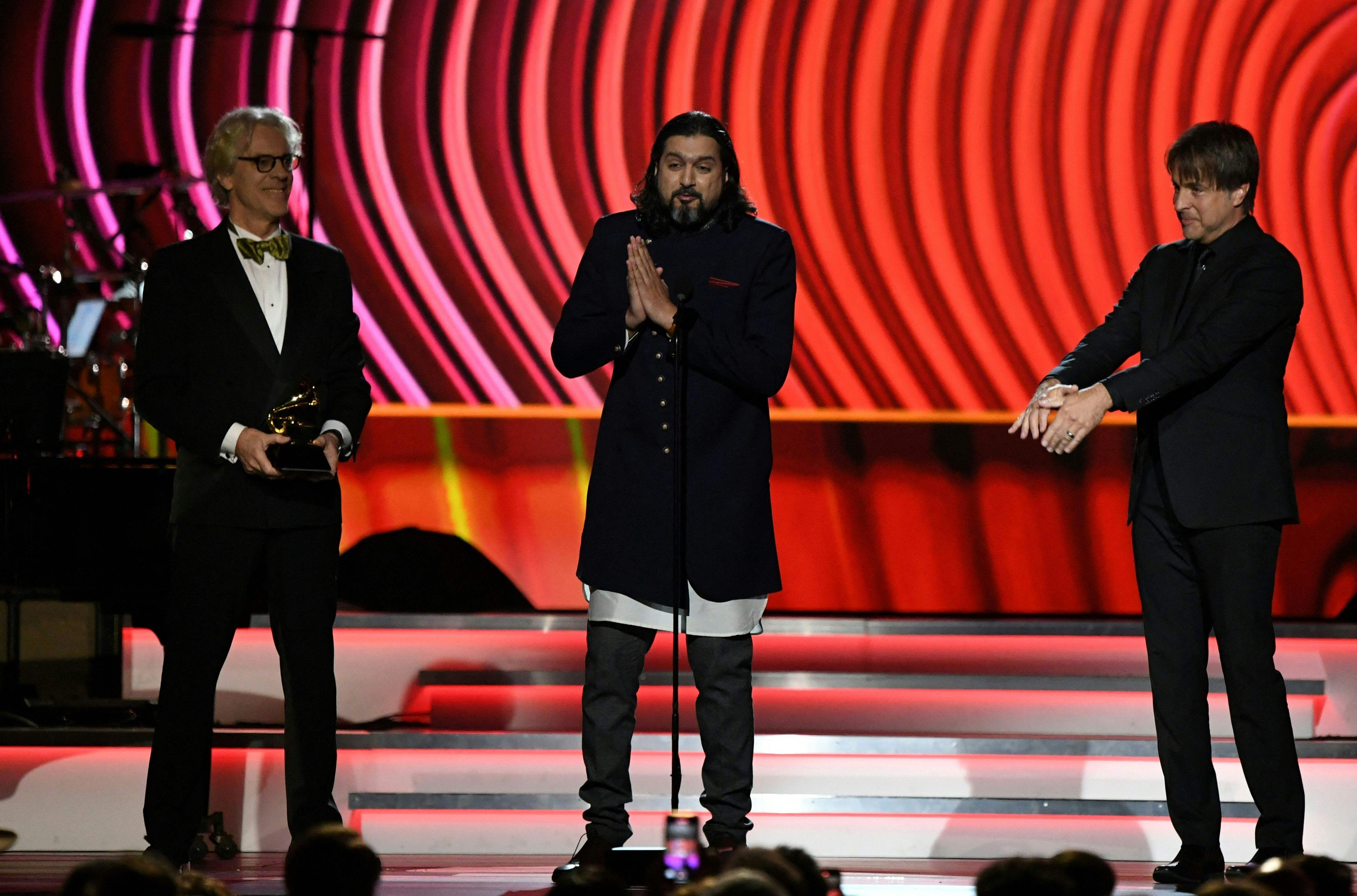 Stewart Copeland and Ricky Kej accept the award for Best New Age album "Divine Tides" during the the 64th Annual Grammy Awards pre-telecast show in Las Vegas on April 3, 2022. (Photo by VALERIE MACON / AFP) (AFP) Stewart Copeland and Ricky Kej accept the award for Best New Age album "Divine Tides" during the the 64th Annual Grammy Awards pre-telecast show in Las Vegas on April 3, 2022. (Photo by VALERIE MACON / AFP) (AFP)