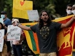 People shout slogans against Sri Lanka's President Gotabaya Rajapaksa and demand Rajapaksa family politicians step down. REUTERS/Dinuka Liyanawatte