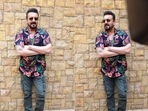 A floral print shirt exudes a cool and easy-breezy vibe.